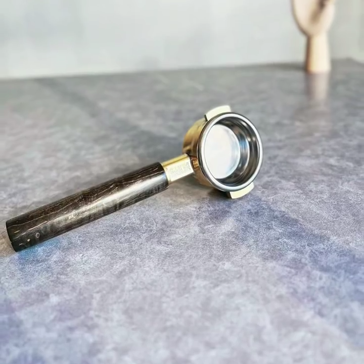 Obsidian Brass Artisan Bottomless Portafilter paired with La Marzocco espresso machine setup
