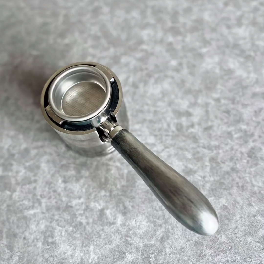 Obsidian Steel Artisan Bottomless Portafilter wood, resin, or metal material detail close-up